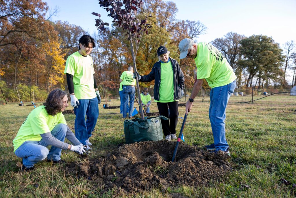 Volunteers planting a tree during the annual Purdue Day of Service.