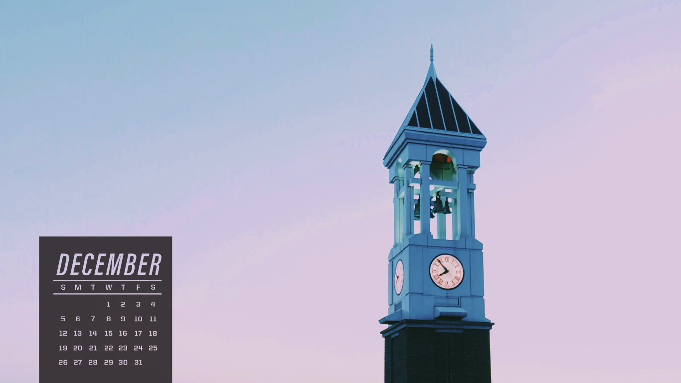 The Purdue Clock Tower with purple sky in the background. December calendar on the lower left.