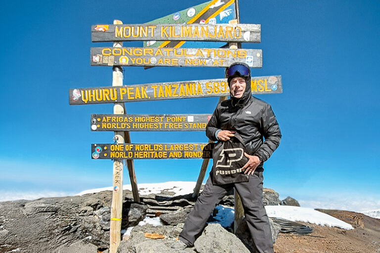 Mark Nelson at the top of Mount Kilimanjaro