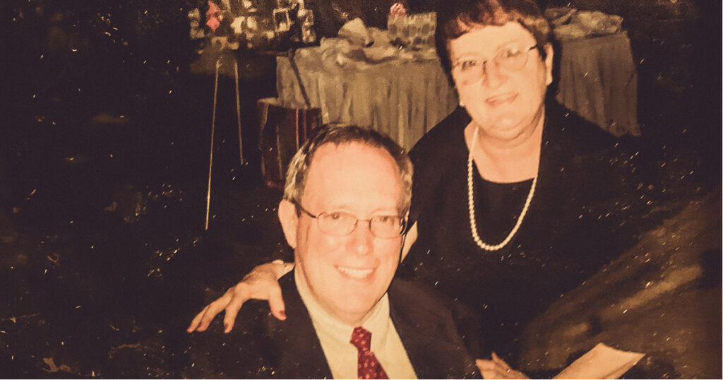 David and Alice Caputo smiling with their arms around one another