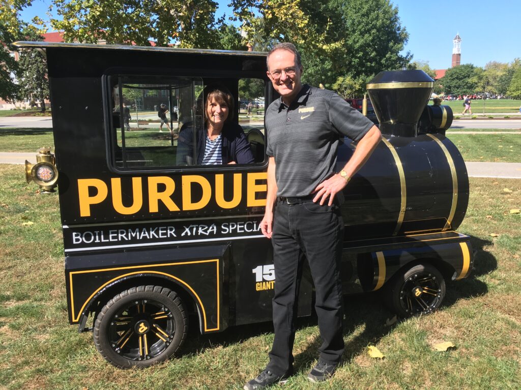Mike and his wife Cindy Hoffman pictured in front of Purdue "Boilermaker Xtra Special" train.