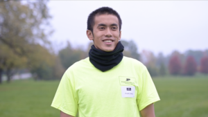 Po-Yu Liang - wearing yellow shirt with black scarf.