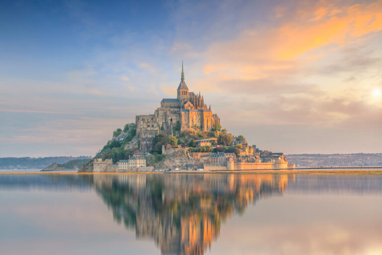 Mont Saint-Michel at sunset twilight in Normandy, northern France