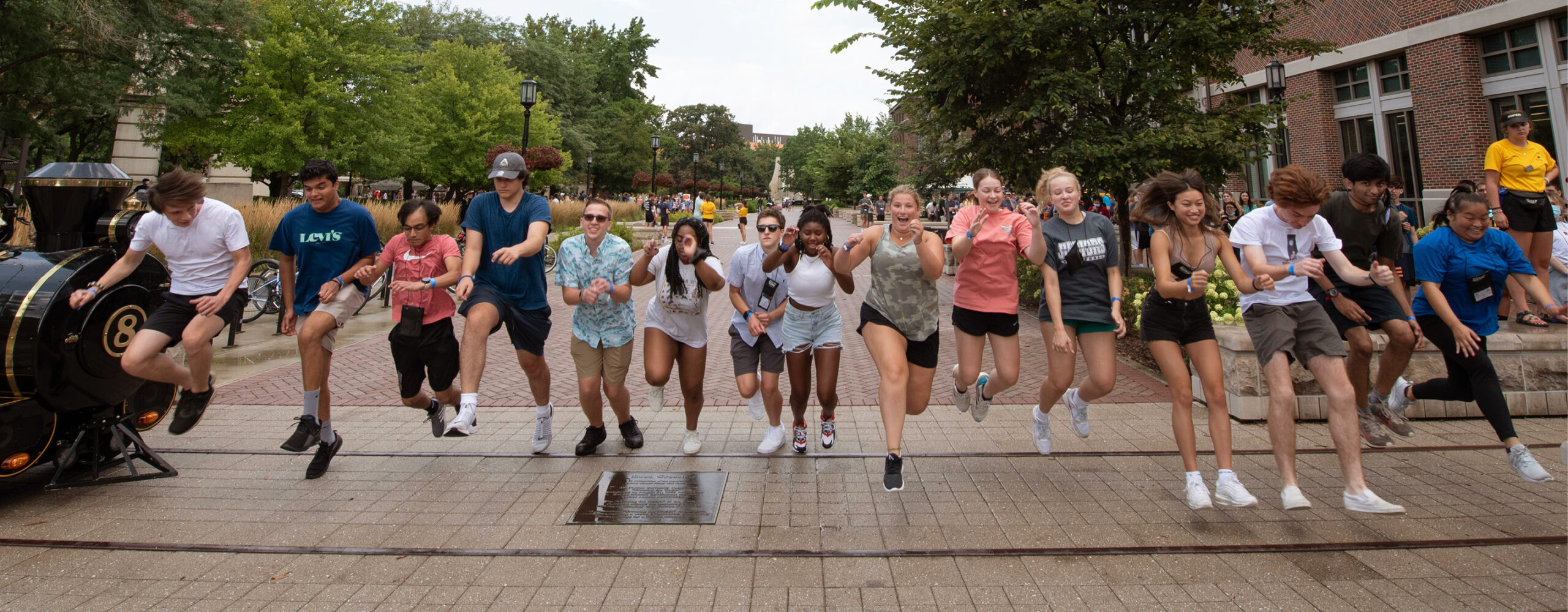 Incoming Purdue Freshman jumping across the Rush Crossing as apart of Purdue's Boiler Gold Rush Orientation