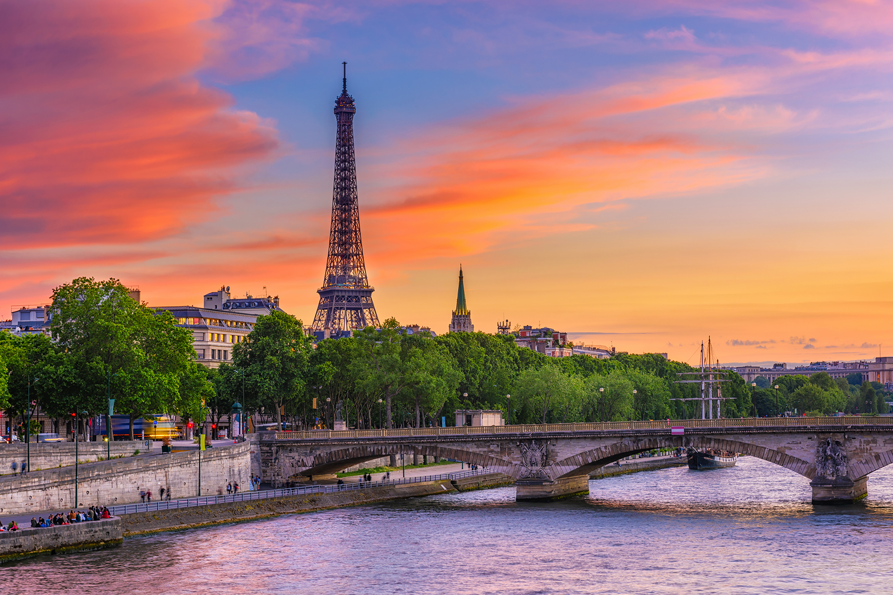 Sunset view of Eiffel tower and Seine river in Paris, France. Eiffel Tower is one of the most iconic landmarks of Paris. Cityscape of Paris.