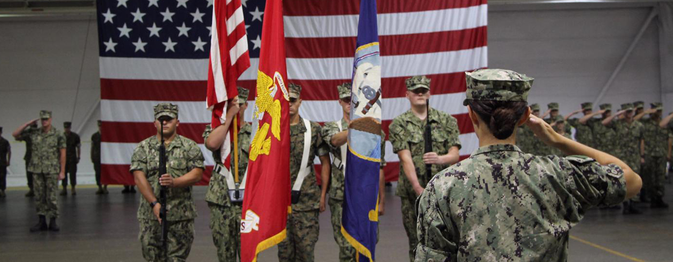 An image showing Purdue Naval ROTC Alumni holding the frag.