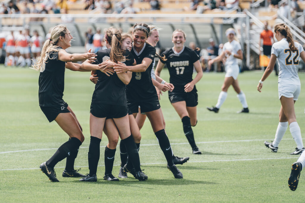 Purdue University Soccer players in the field