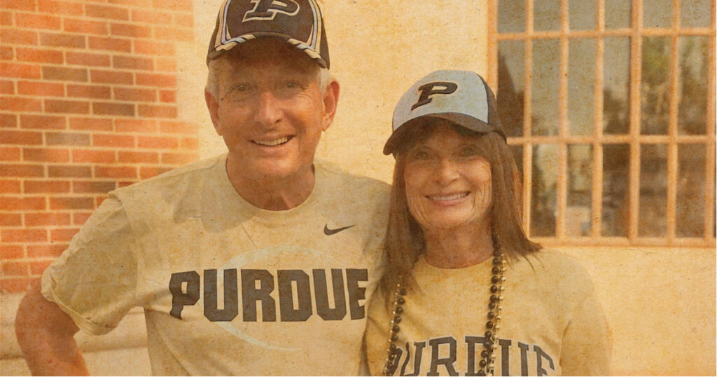 Jack and Kay Hayes smiling while wearing Purdue Merchandise