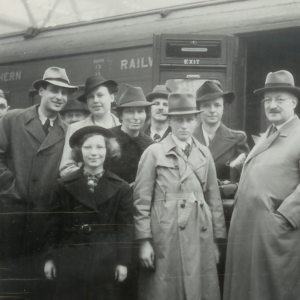 Wormser Family standing in front of a train