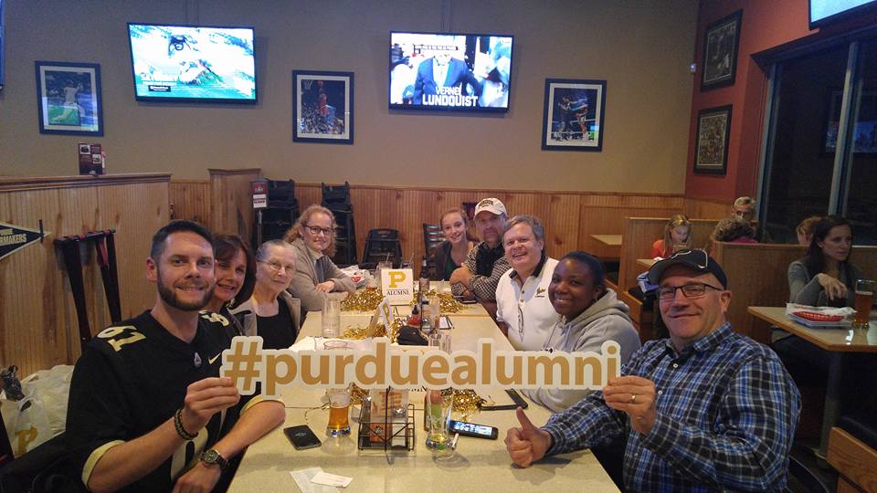 A group of Purdue Alumni posing for a photo