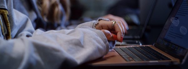 Person typing on Laptop