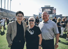 President Mung Chiang; Arnette Tiller, wife of Joe Tiller; and Purdue athletic director Mike Bobinski.