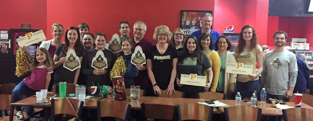 A group of Purdue Alumni posing for a photo