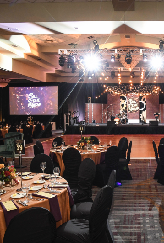 Boilermaker Ball steampunk theme stage with views of tables and the dance floor