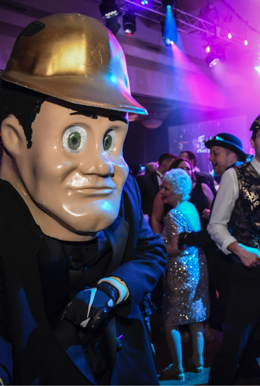 Purdue Pete on the dance floor with people around him