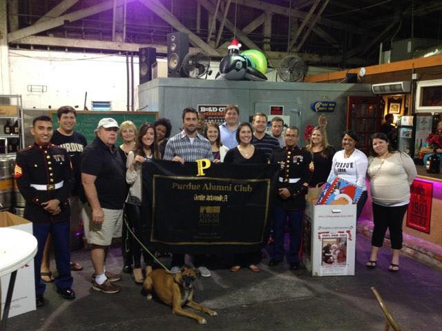 A group of Purdue Alumni posing for a photo