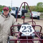 Mike Brennan in front of ancient Rupp kart