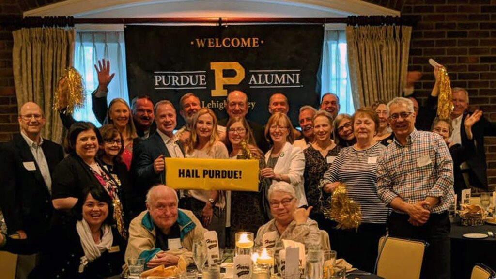 A group of Purdue Alumni posing for a photo