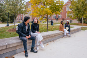 A group of students talking to each other at Purdue University