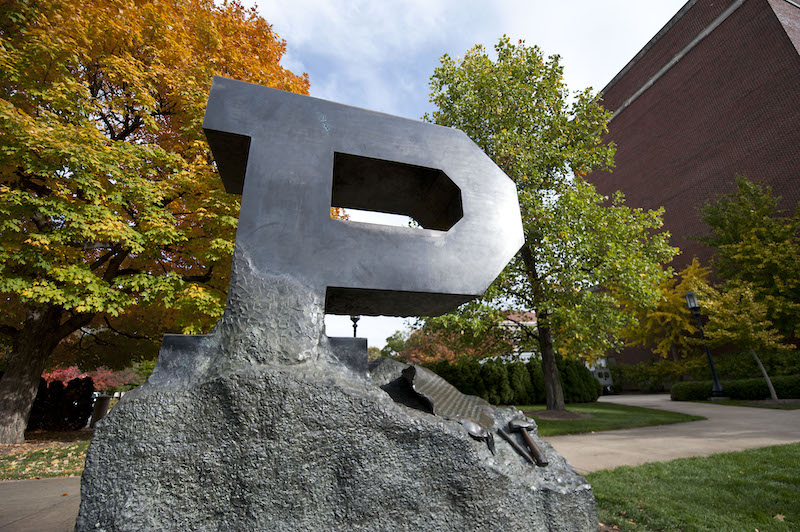 A rock with the letter P carved out of it. It's painted black.