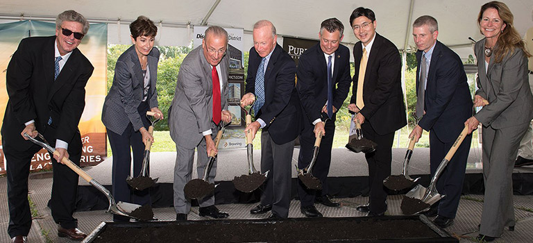 Mitch Daniels and a group of Purdue University executives breaking ground for a new building