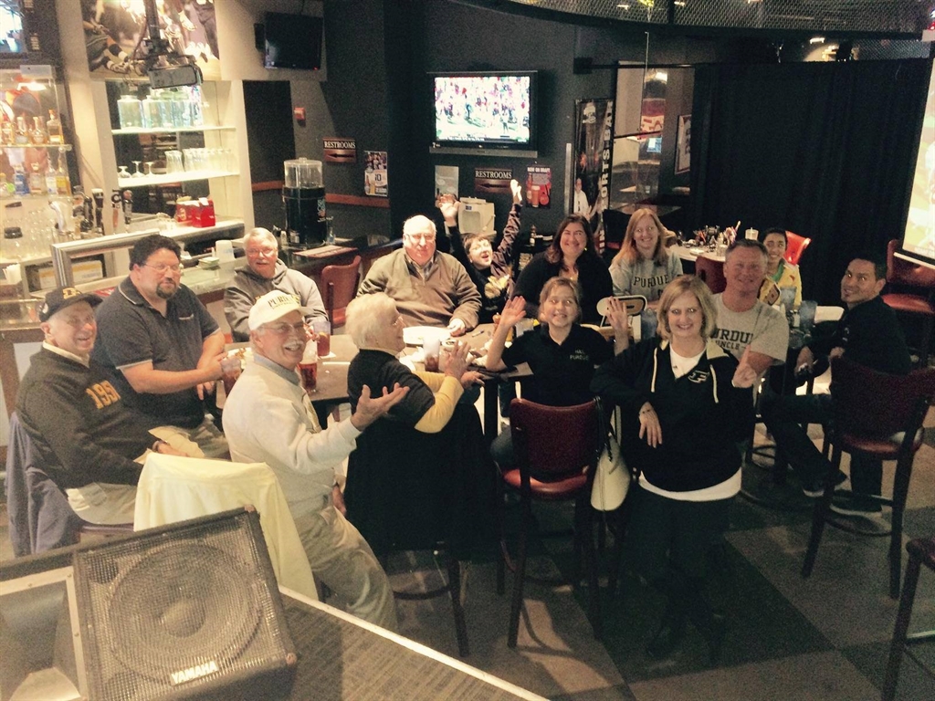 A group of Purdue Alumni posing for a photo