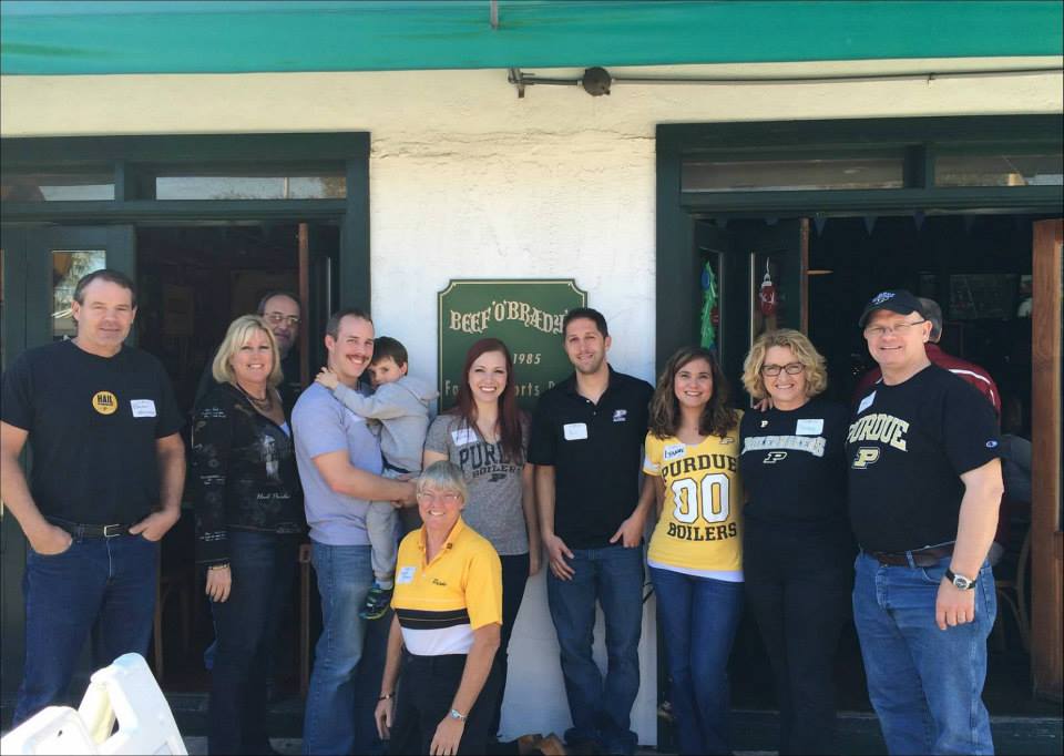 A group of Purdue Alumni posing for a photo