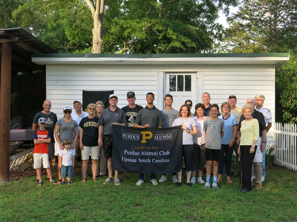 Purdue Alumni club posing for a photo